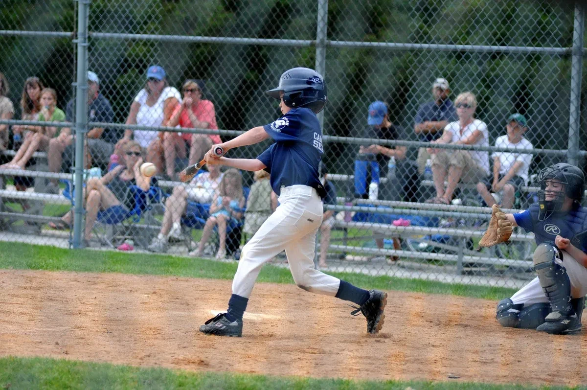 A kid playing baseball