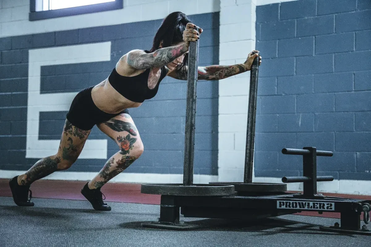 A woman exercising in a CrossFit class