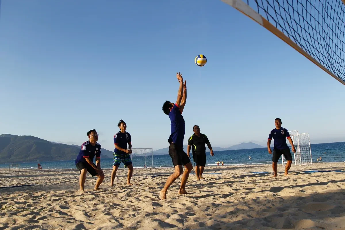 A team playing beach volleyball