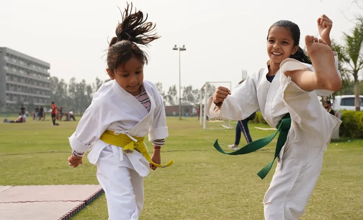 Kids practicing karate outside
