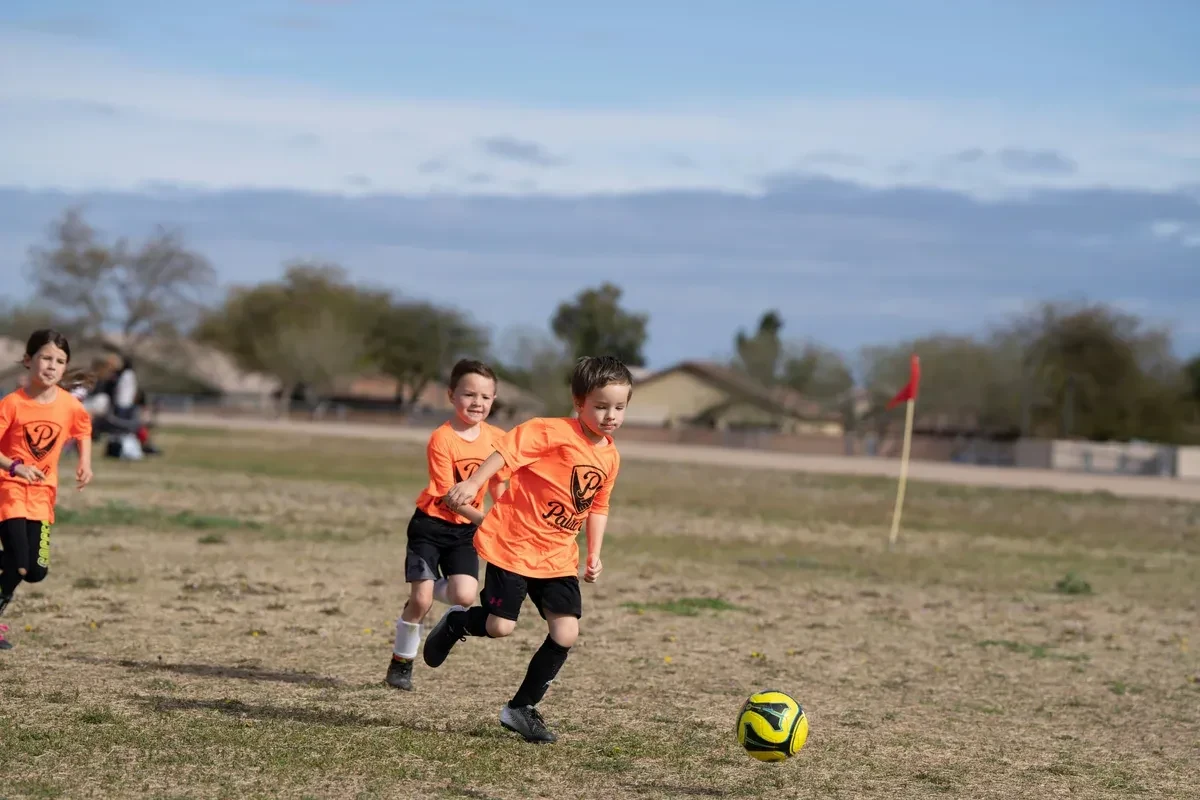 Youth soccer players building diverse motor skills, one of the primary benefits of being a multi-sport athlete