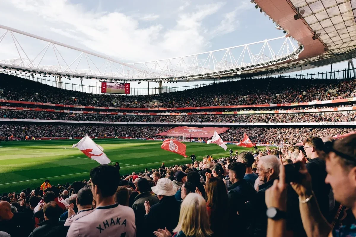 Soccer fans at a stadium watching the game